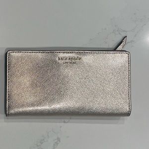 Kate Spade bifold wallet in metallic champagne